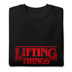 Suéter negro Stranger Things Lifting Things Parody doblado