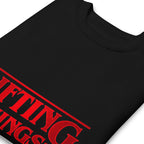 Suéter negro Stranger Things Lifting Things Parody doblado zoom
