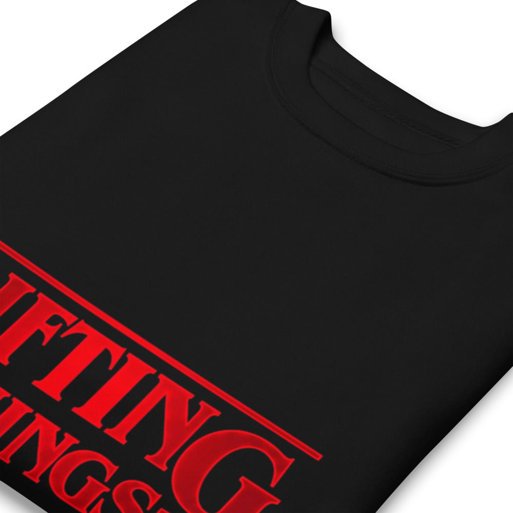 Suéter negro Stranger Things Lifting Things Parody doblado zoom